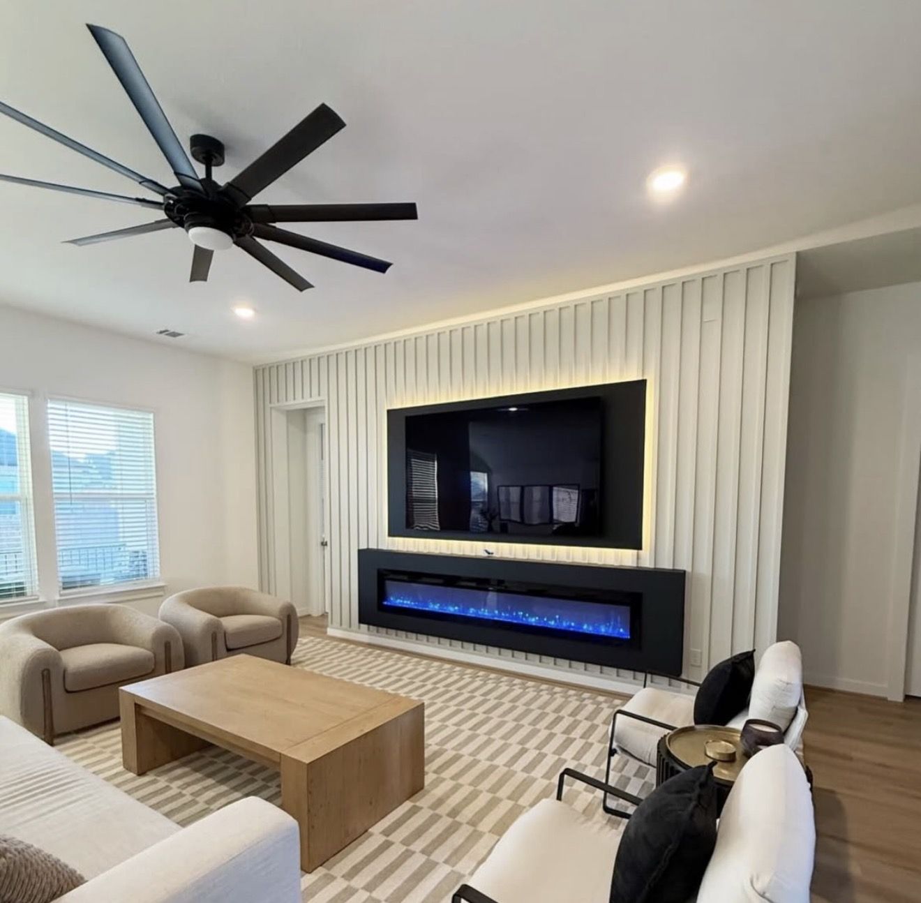 Finished slat panel TV accent wall with mounted TV and built-in fireplace, Clermont FL
